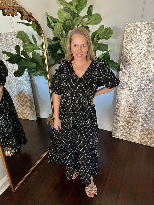 black and gold eye let midi dress